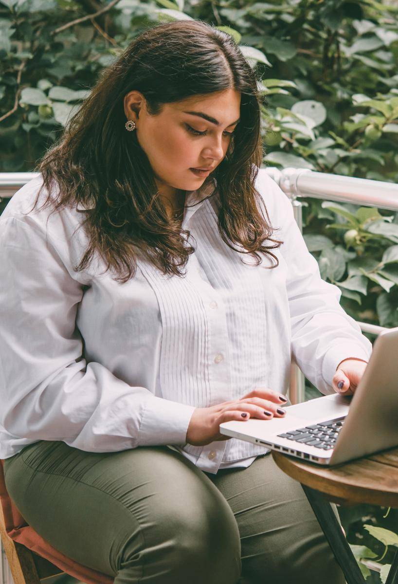 woman working by laptop